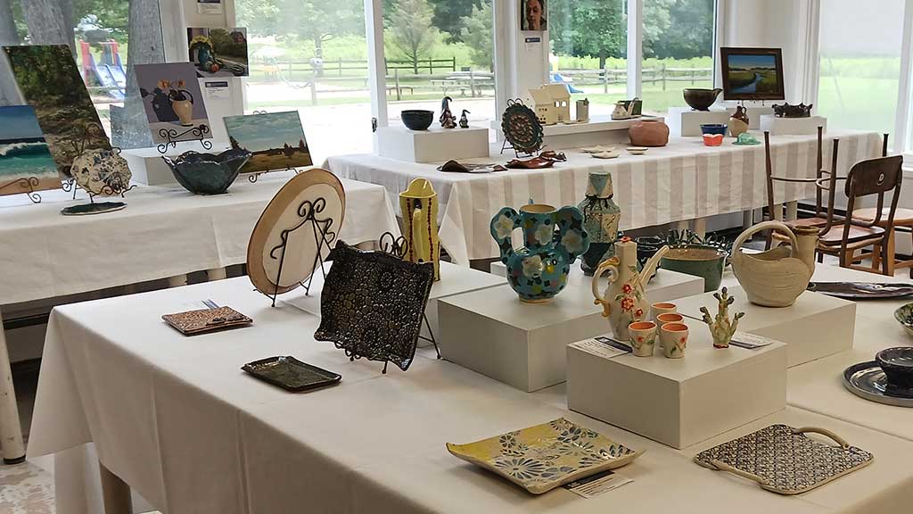 A photo of a gallery from a student and teacher art exhibit