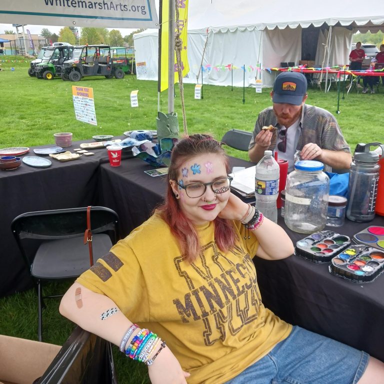 Our Youth-Board Volunteer and face-painter Bex. With our Board President Mike in the background